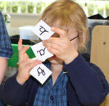 Child learning handwriting concepts through play, games and interactive activities